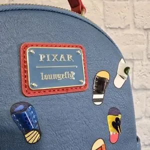 Loungefly | Bags | Loungefly Pixar Disney Compilation Slides 